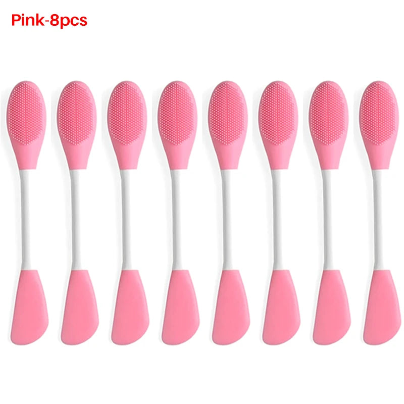 A set of eight pink silicone facial brushes for exfoliation