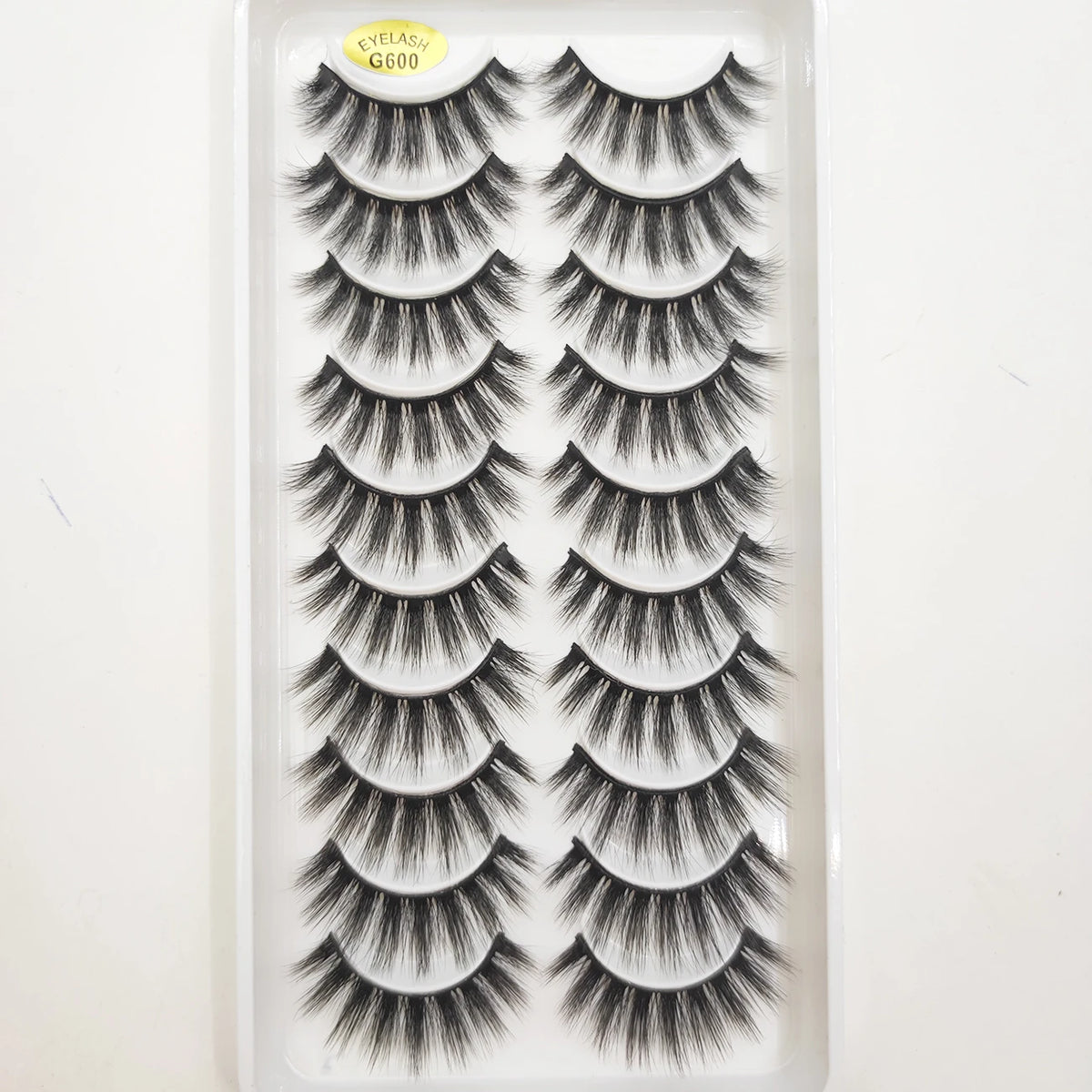 A display of natural 3D mink false eyelashes in various styles and lengths.