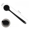 Black silicone back scrubber brush with a long handle and a circular cleaning head.