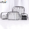 Clear waterproof travel cosmetic bags containing various liquid and solid toiletries