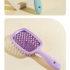 A set of three wooden and silicone hair brushes for detangling, shown in teal, purple, and pink.