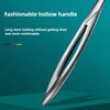 Close-up of a stainless steel cuticle pusher with a fashionable hollow handle against a teal background.