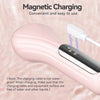 A pink sonic facial cleansing brush is shown with a white charging cable, demonstrating magnetic charging.