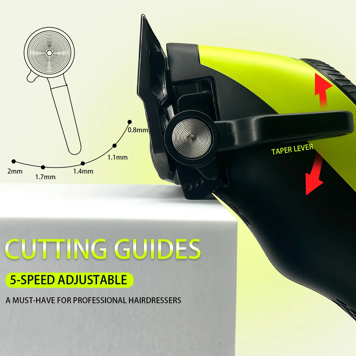 Close-up of a professional cordless hair clipper with cutting guides and taper lever shown next to a white box.