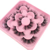 A pink plastic tray holding a set of black artificial mink eyelashes.
