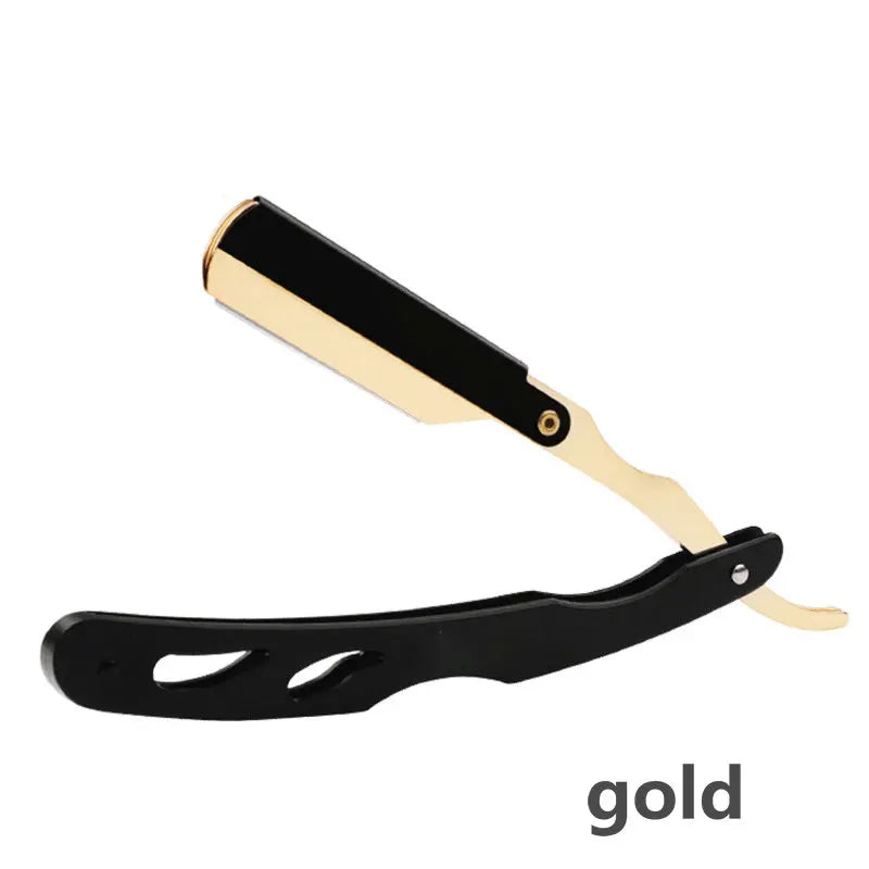 A gold and black professional straight edge barber razor.