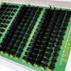 A display of black thick spiky cluster eyelash extensions packaged in green boxes.