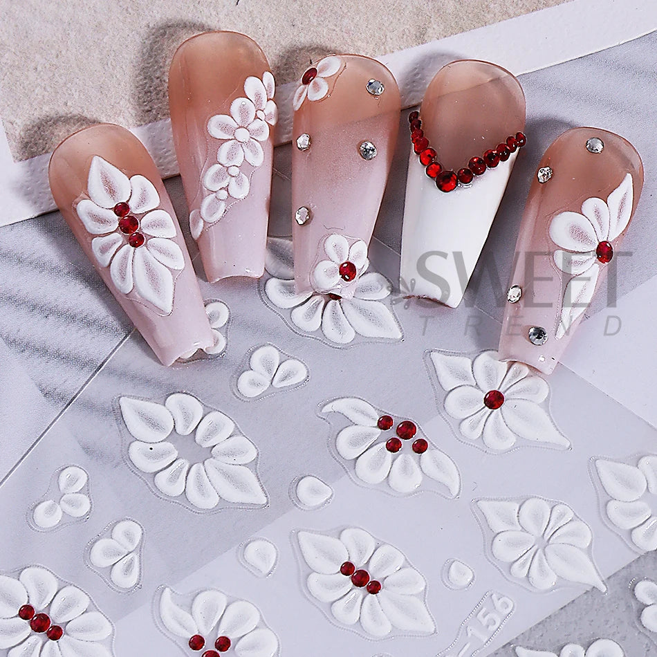 A set of two pink and white floral nail stickers featuring embossed white flowers and red accents.