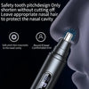 A close-up of a black nose hair trimmer being used on a person's nose.