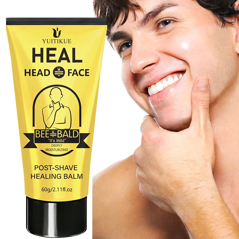 A man is applying Bee Bald Post-Shave Healing Balm for men to his face.