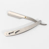 A stainless steel folding shaving razor set with a handle and blade visible.
