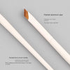 A pair of painted aluminum and birch brush sets for precision eyeliner application