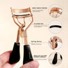 A set of professional stainless steel eyelash curlers with silicone pads and rubber handles shown in use.