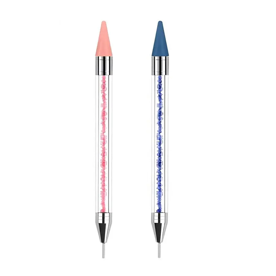 Une paire d'outils à piquer en strass à double extrémité, un rose et un bleu, montrés verticalement.