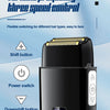 A black electric hair clipper and shaver set with a lid showing double cutter heads and speed controls.