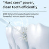 A close-up of a portable dental water flosser is shown cleaning teeth with a pulsed water column.