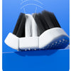 A U-shaped 3D toothbrush set with black and white bristles is shown resting on a blue surface.