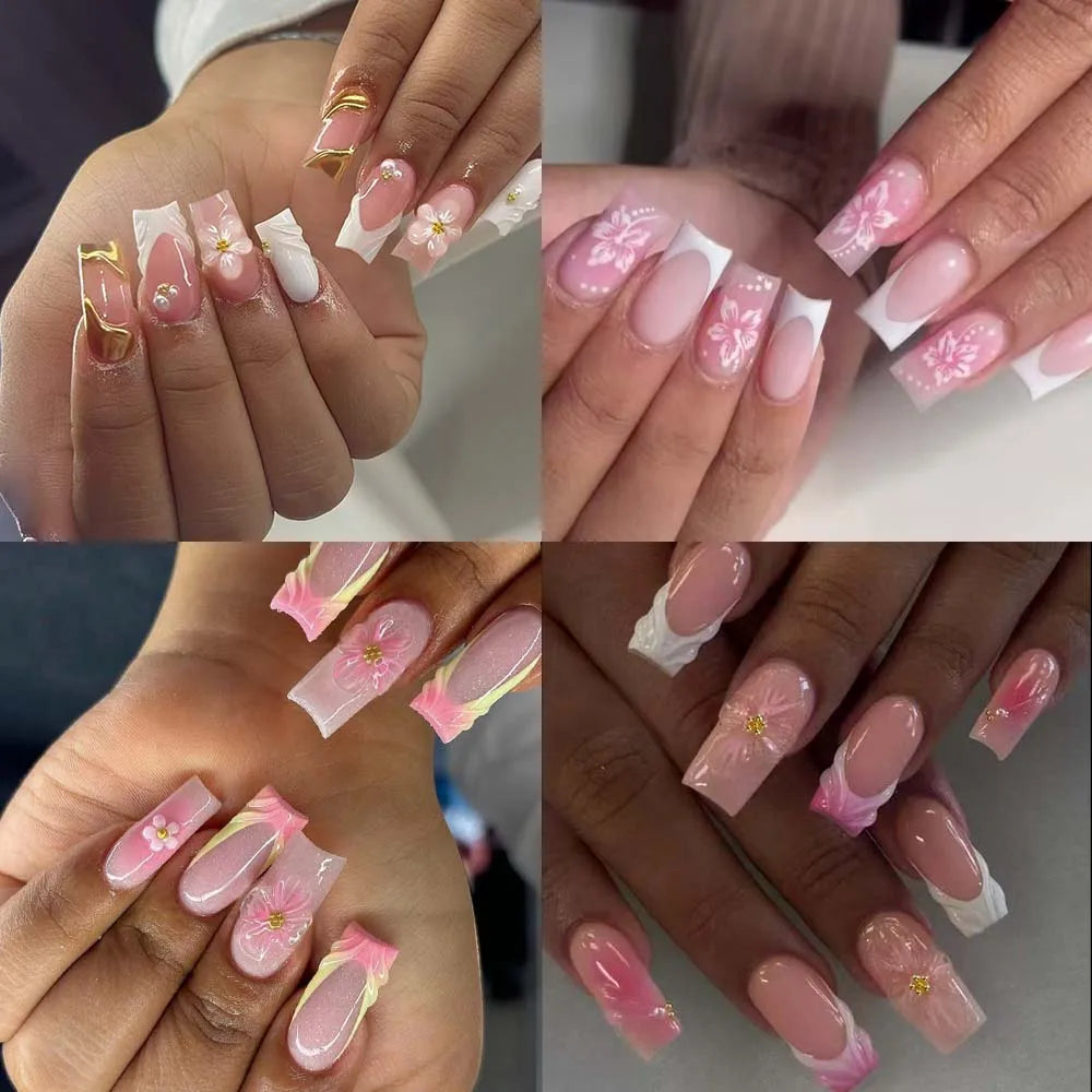 Primer plano de manos mostrando varios diseños de uñas postizas de flor de gel 3D rosa y blanco