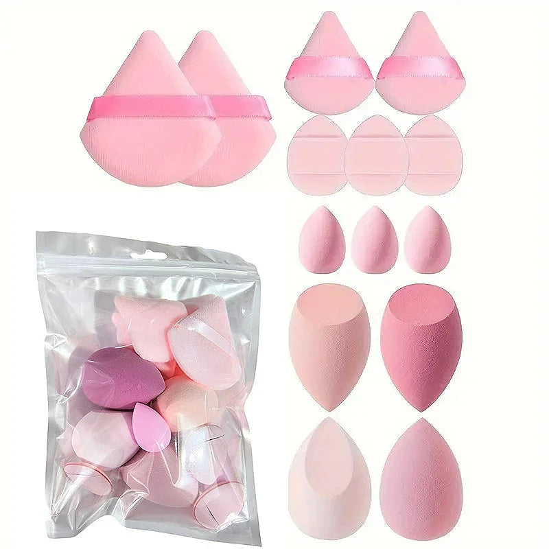A collection of pink and nude makeup brushes and tools packaged in a clear plastic bag.