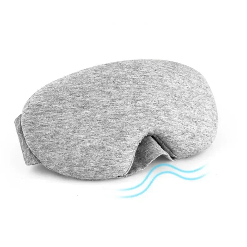 A gray 3D sleeping eye mask is shown lying flat on a white background.