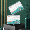 Two clear plastic containers of dental floss picks are displayed on a dark surface with green and gold accents.