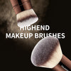 A close-up of a brown makeup brush with light bristles, labeled as a high-end makeup brush.