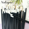 A set of 50 black lip applicator brushes with white tips arranged in a vertical line.