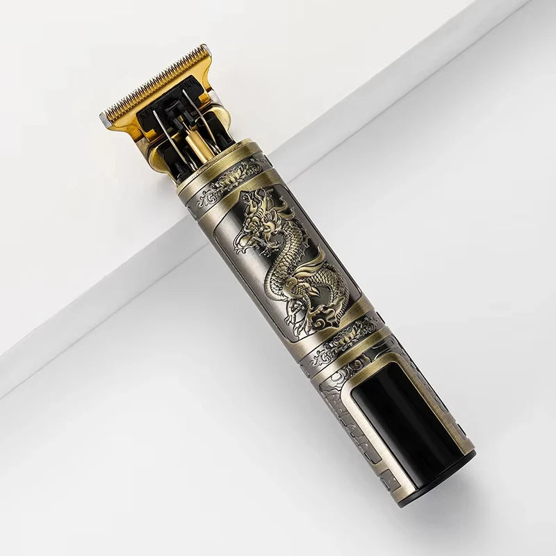 A vintage rechargeable hair clipper trimmer with a gold-colored head and ornate silver detailing.