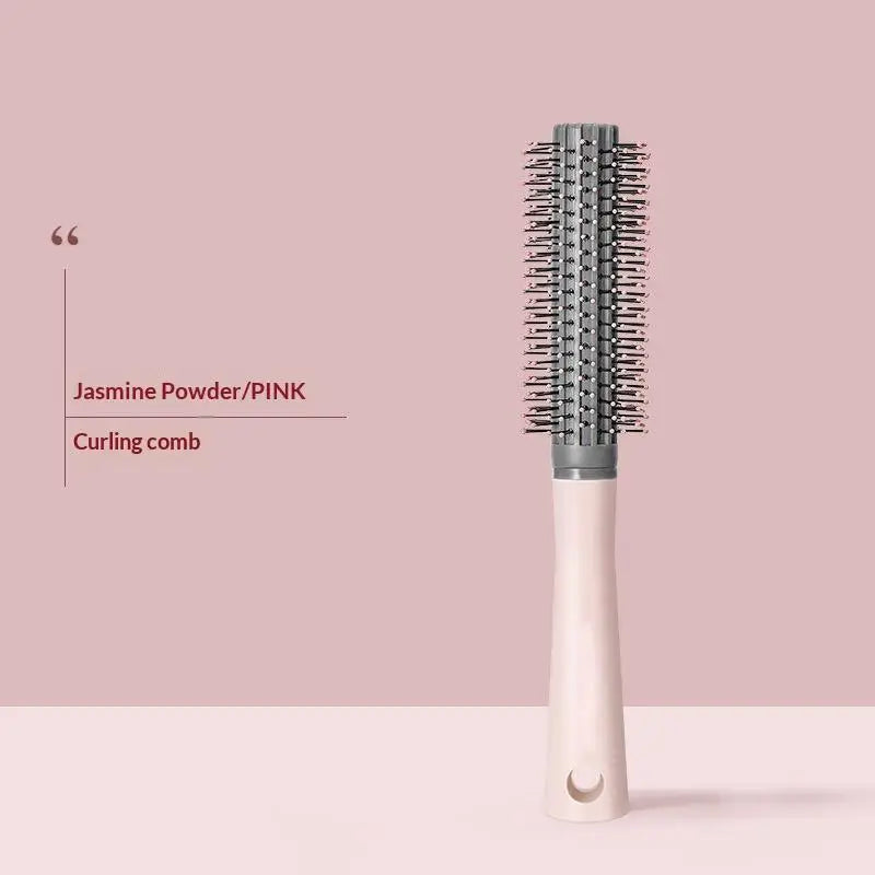 Pinkes Lockenpinsel mit natürlichem Holzgriff und silbernen Borsten.