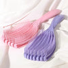 A pink massage detangler hair brush for curly and thick hair is shown against a white background.
