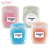 Four plastic containers hold 50m of colored nylon dental floss in pink, green, blue, and orange.
