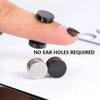Close-up of black magnetic stud earrings being placed on a finger, showing the size and finish.