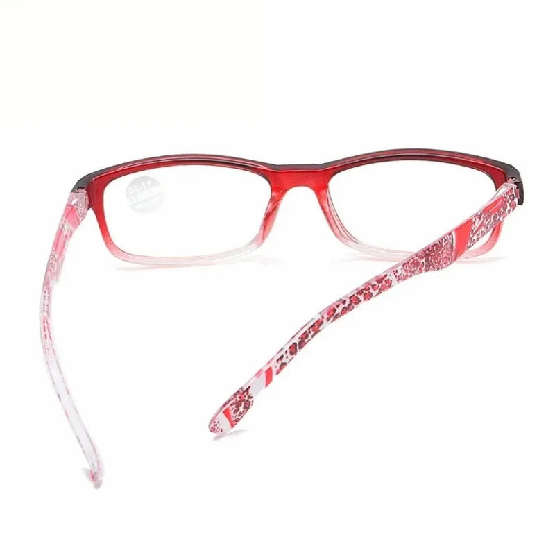 A pair of red-framed retro style anti-blue light reading glasses.