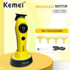 A yellow Kemei brushless motor hair clipper with accessories displayed on a light background.