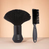 A black professional hair styling and cleaning brush set featuring a wide brush and a fine comb.