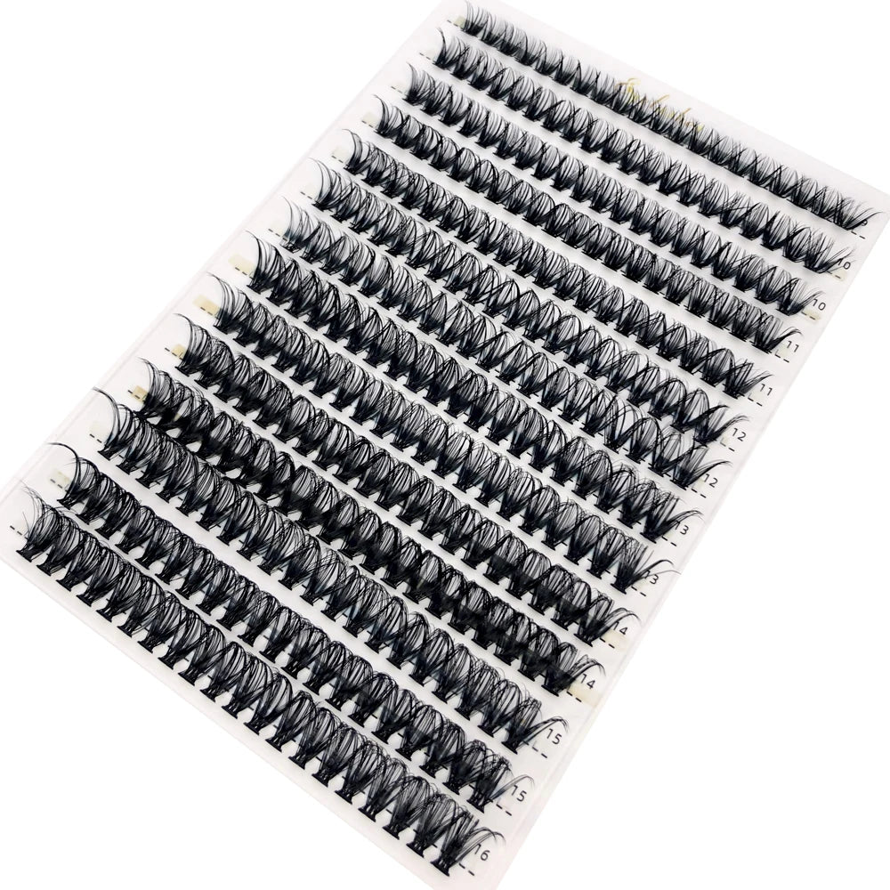 A tray of mixed false eyelashes displayed on a white background.