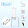 A clear portable dental water flosser device with a white top and power adapter included.