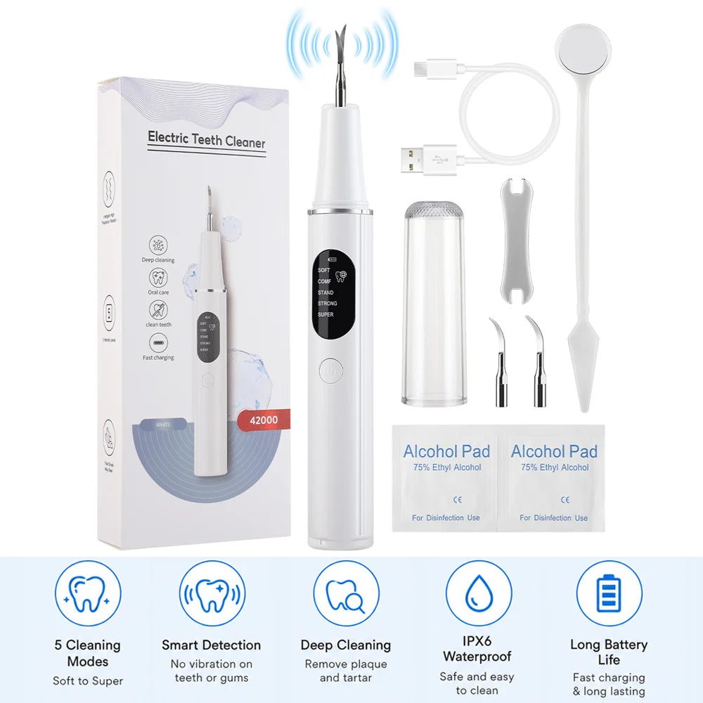 A white electric teeth cleaner device with accessories for deep cleaning and plaque removal.