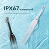 A white sonic electric toothbrush floating in clear water, demonstrating its IPX67 waterproof feature.