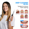 A woman holds an ultrasonic teeth cleaning tool, demonstrating its use for dental cleaning.
