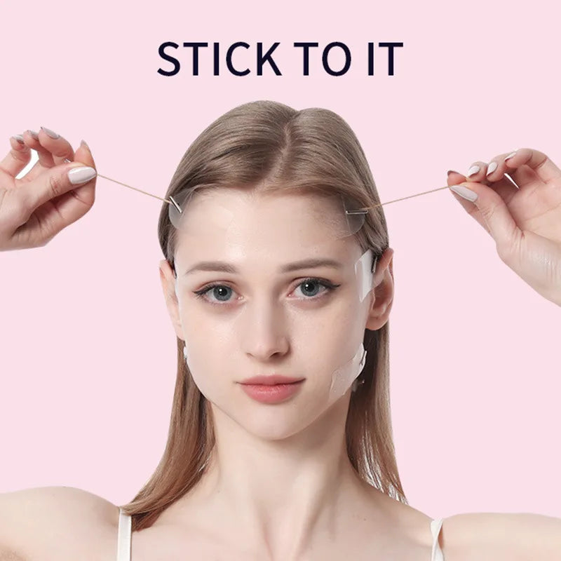 A woman is applying invisible facial lifting tape for contouring to her face.