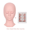A pink silicone mannequin head with a box containing artificial box eyelids for practice.
