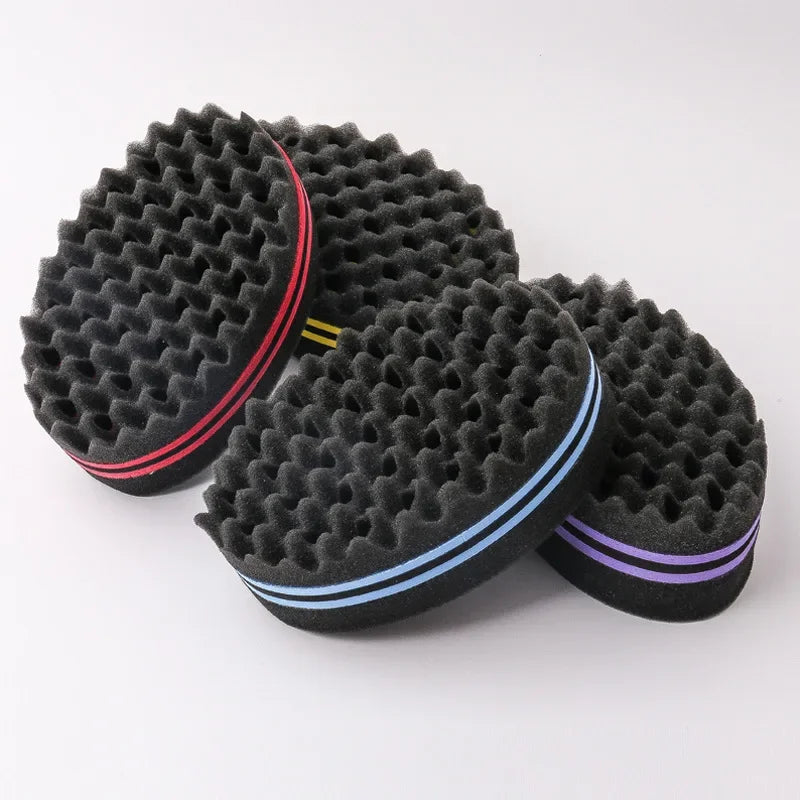 A black dual-sided hair braiding brush with a textured surface and colored accents.