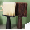 A pair of dark brown and cream soft bristle hair duster brushes displayed on a surface.
