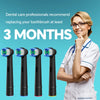 A smiling woman in a medical coat holds five replacement toothbrush heads for oral-B electric brushes.