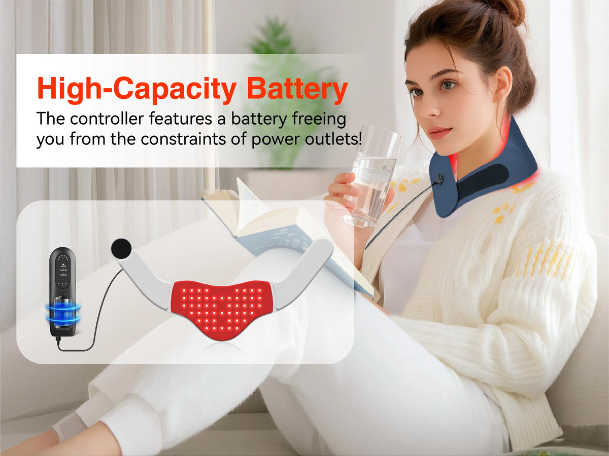 A woman is wearing a red light therapy belt while relaxing indoors.