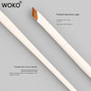A painted aluminum eyeliner brush with a pointed tip and a smooth handle shown against a gray background.