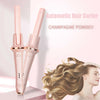 Pink automatic hair curler with champagne powder finish curling long brown hair