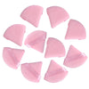 A collection of pink makeup sponge puffs in various shapes and angles.