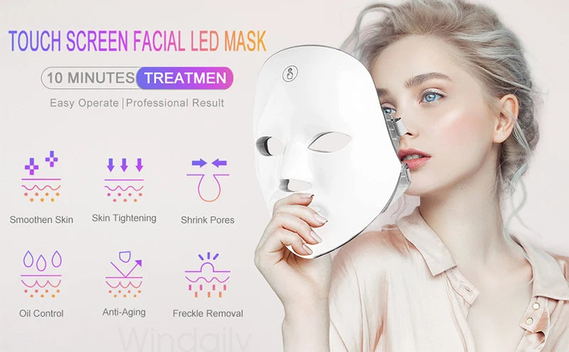 A woman applies a white touch screen facial LED mask for skincare treatments.